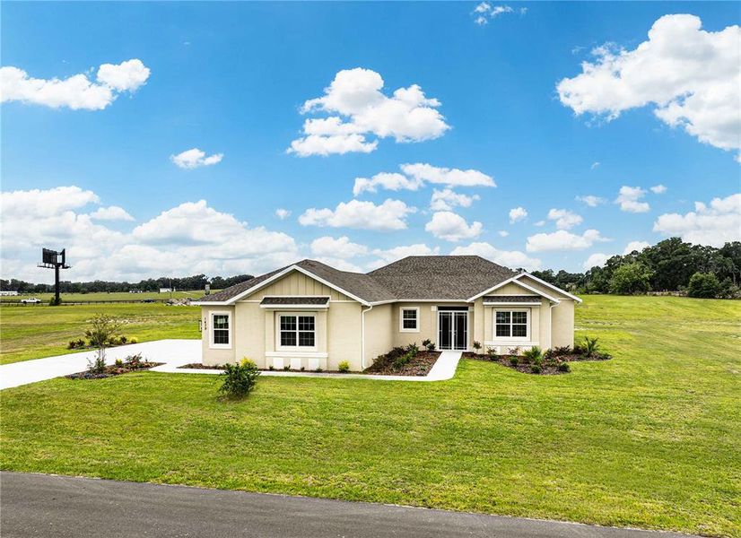 Front exterior of a new home in , Oxford, FL, highlighting curb appeal (Image 25).