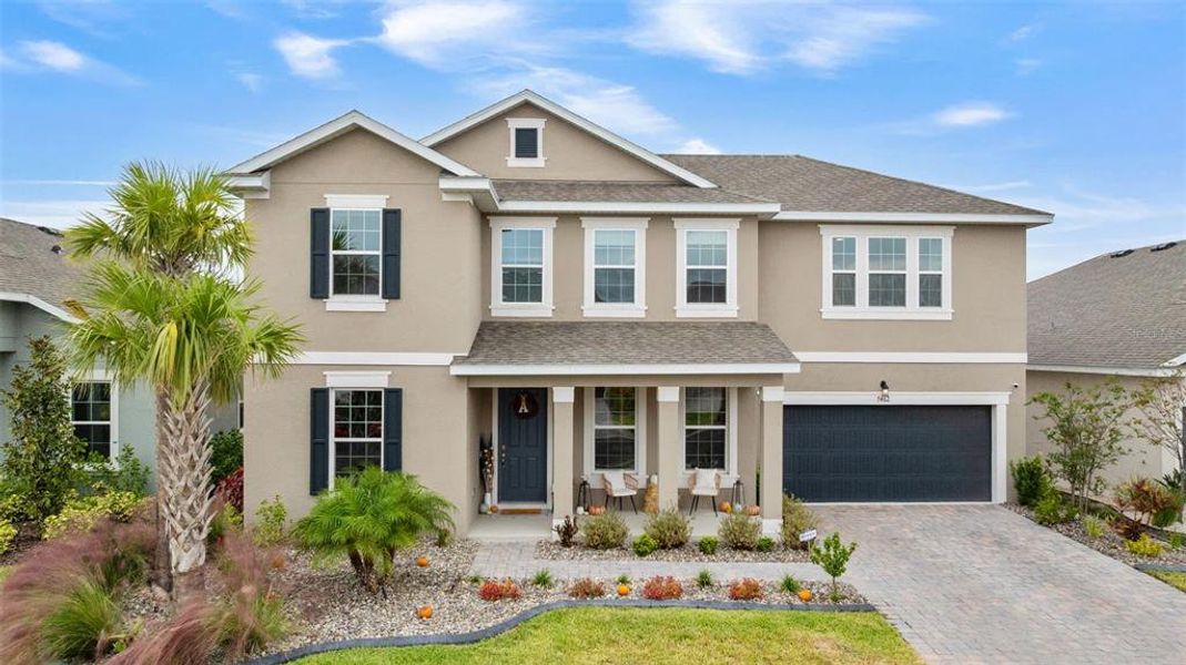 Front exterior of a new home in Seaire, Parrish, FL, highlighting curb appeal (Image 2).