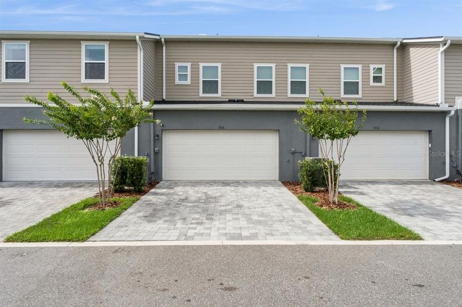 Front exterior of a new home in , Apopka, FL, highlighting curb appeal (Image 24). Front exterior of a new home in , Apopka, FL, highlighting curb appeal (Image 24).