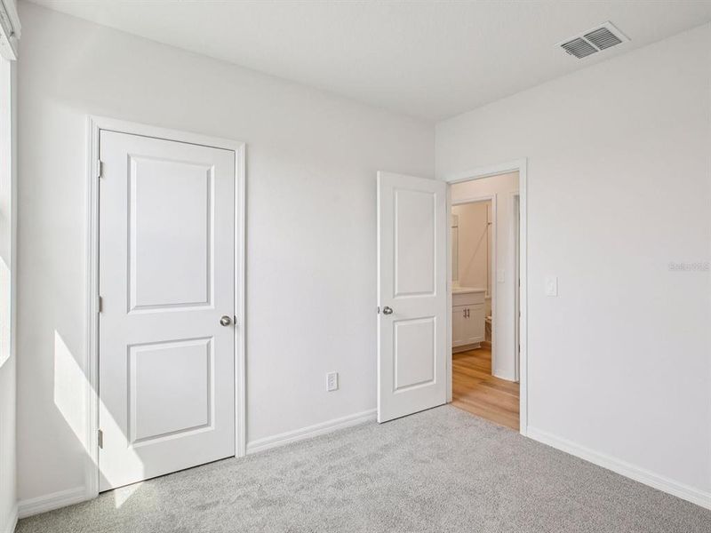 Spacious, unfurnished interior of a new home in The Grove at Stuart Crossing - Premier Series, Bartow (Image 19).