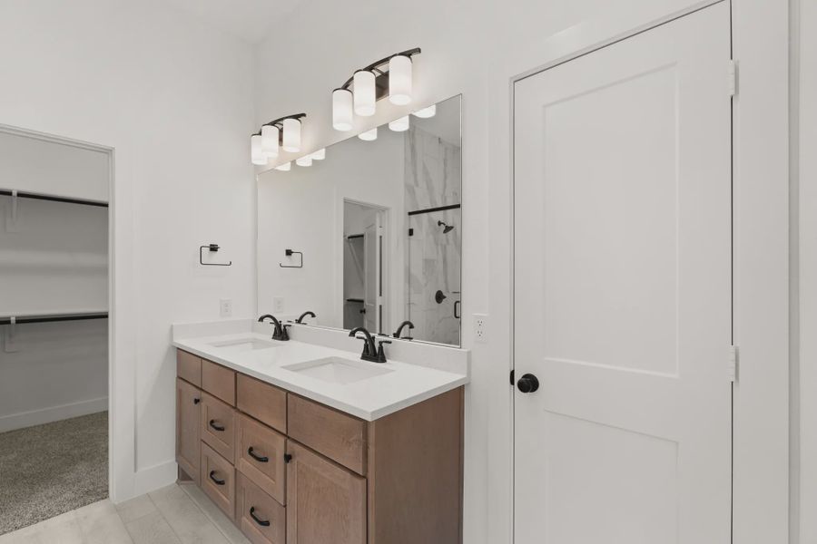 Representative furnished interior of a home built from the Pinehurst by Chesmar Homes in Riceland Alley Loads, Mont Belvieu (Image 11).