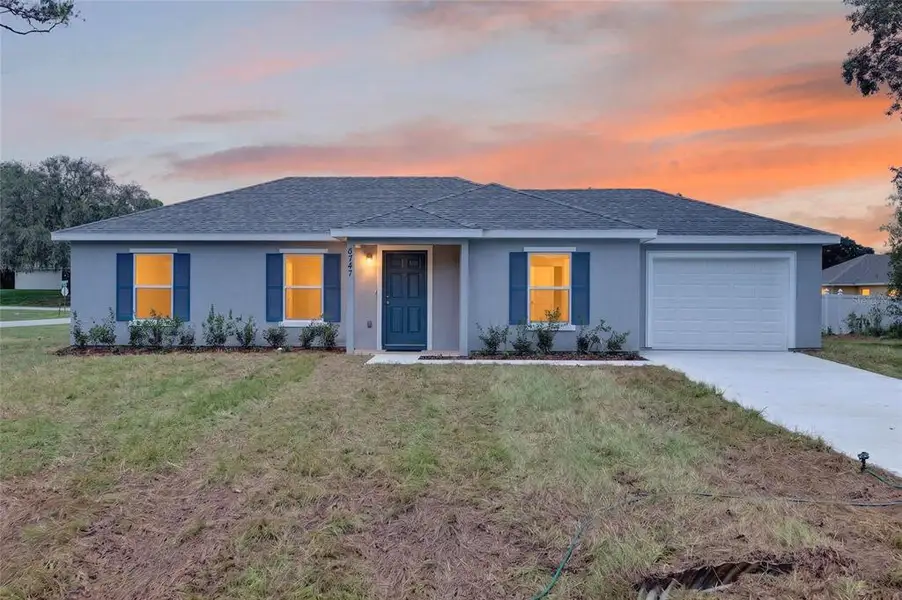 Front exterior of a new home in , Ocala, FL, highlighting curb appeal (Image 2). Front exterior of a new home in , Ocala, FL, highlighting curb appeal (Image 2).