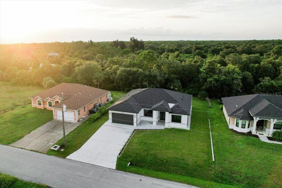 Front exterior of a new home in , North Port, FL, highlighting curb appeal (Image 31). Front exterior of a new home in , North Port, FL, highlighting curb appeal (Image 31).