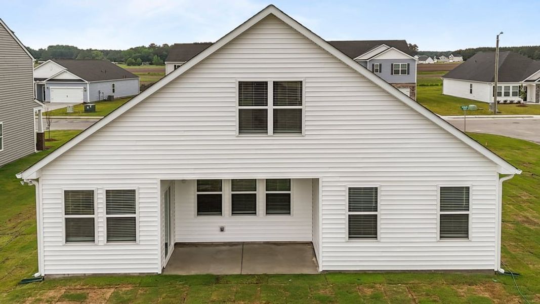 Exterior details and patio area of a home in East Ridge, Ayden (Image 4).