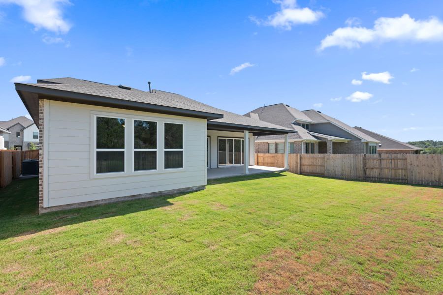 Exterior details and patio area of a home in Lariat, Liberty Hill (Image 28).