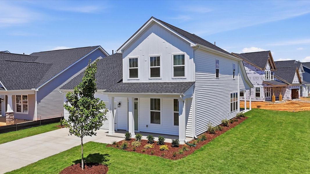 Front exterior of a new home in Walnut Ridge, Inman, SC, highlighting curb appeal (Image 2). Front exterior of a new home in Walnut Ridge, Inman, SC, highlighting curb appeal (Image 2).