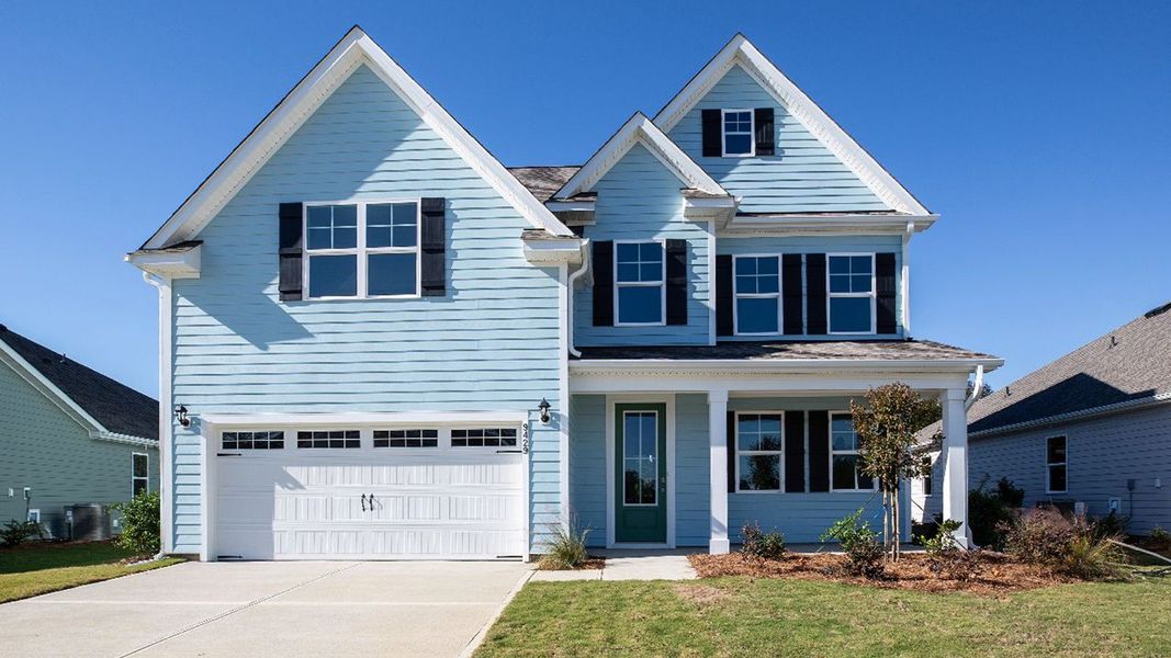 Front exterior of a new home in Indigo Preserve, Leland, NC, highlighting curb appeal (Image 1).