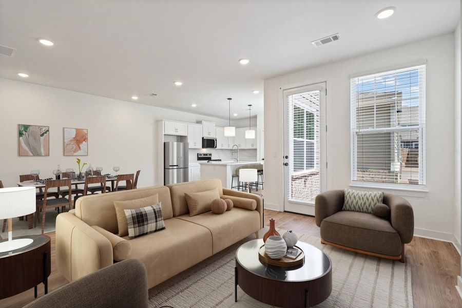 Open-concept living area with wood-finish flooring