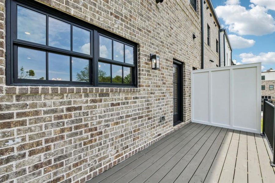 Exterior details and patio area of a home in Skyview On Broad, Sugar Hill (Image 23).