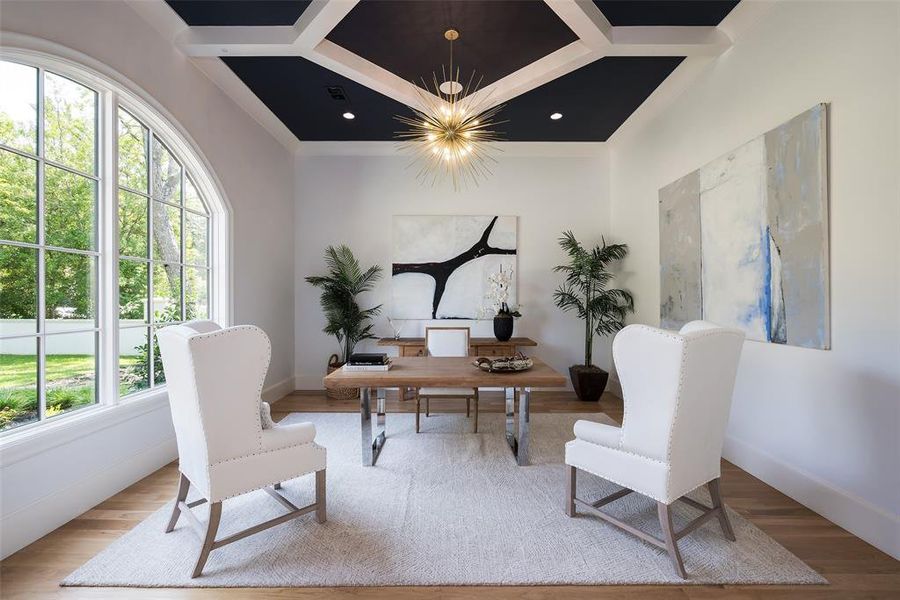 Office area featuring wood-type flooring, a notable chandelier, and coffered ceiling