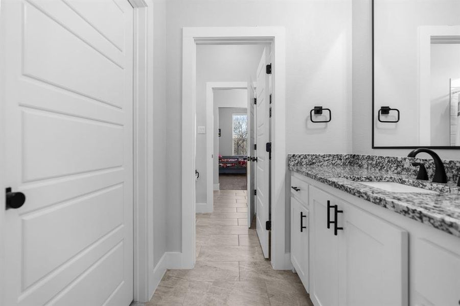 Bathroom with tile flooring and vanity