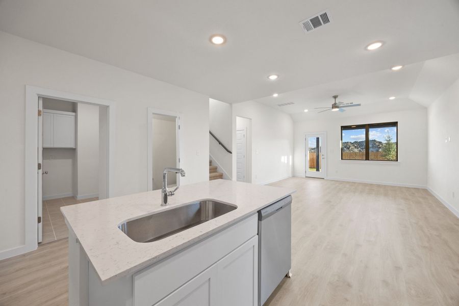 Kitchen in the Pearl home plan by Trophy Signature Homes – REPRESENTATIVE PHOTO