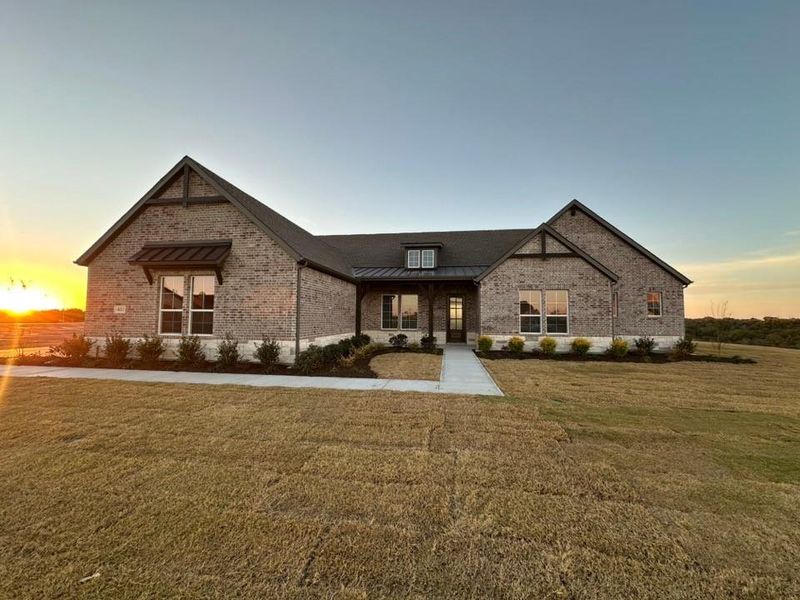 Front exterior of a new home in Eagle Ridge Estates, Weatherford, TX, highlighting curb appeal (Image 1). Front exterior of a new home in Eagle Ridge Estates, Weatherford, TX, highlighting curb appeal (Image 1).