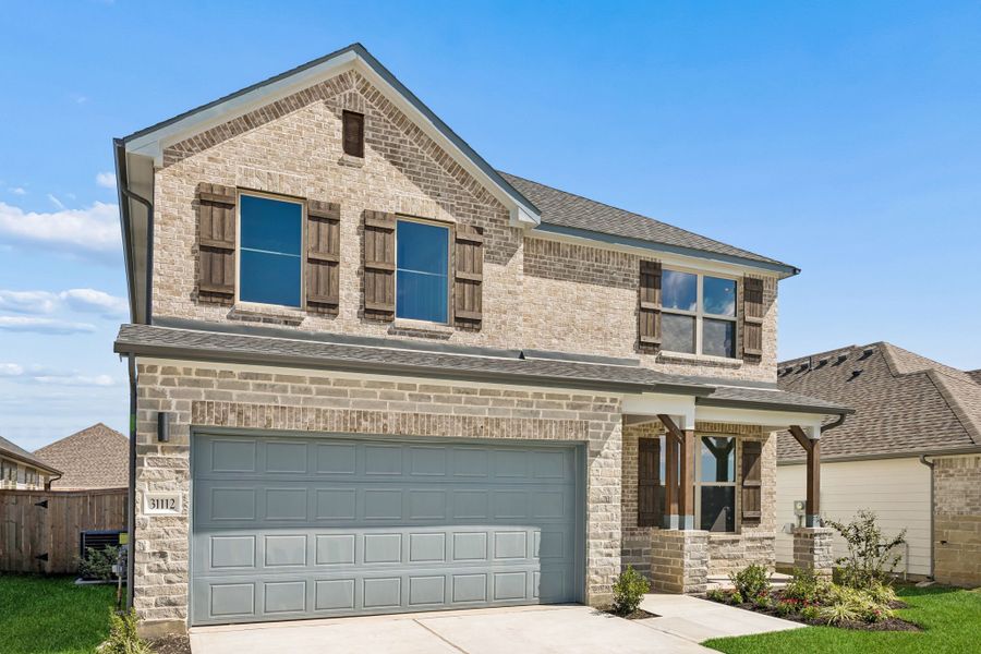 Front exterior of a new home in Riviera Pines, Huffman, TX, highlighting curb appeal (Image 2). Front exterior of a new home in Riviera Pines, Huffman, TX, highlighting curb appeal (Image 2).