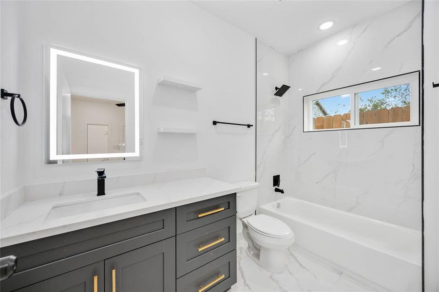 First floor bathroom: Beautiful finishes with spacious vanity and full bathtub