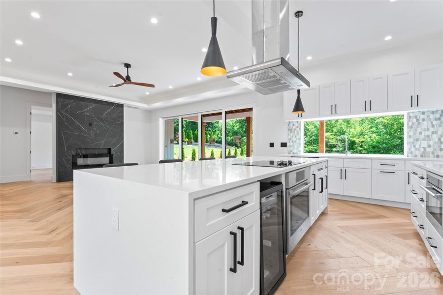 beverage fridge, dishwasher, hood, quartz conters