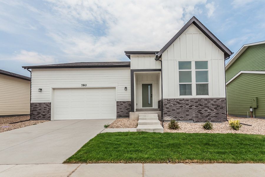 Front exterior of a new home in Prairie Song, Windsor, CO, highlighting curb appeal (Image 29). Front exterior of a new home in Prairie Song, Windsor, CO, highlighting curb appeal (Image 29).