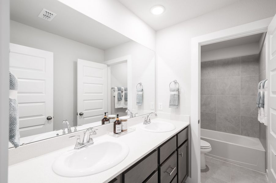 Representative furnished interior of a home built from the Yellowstar by Tri Pointe Homes in Mason Woods, Cypress (Image 17).