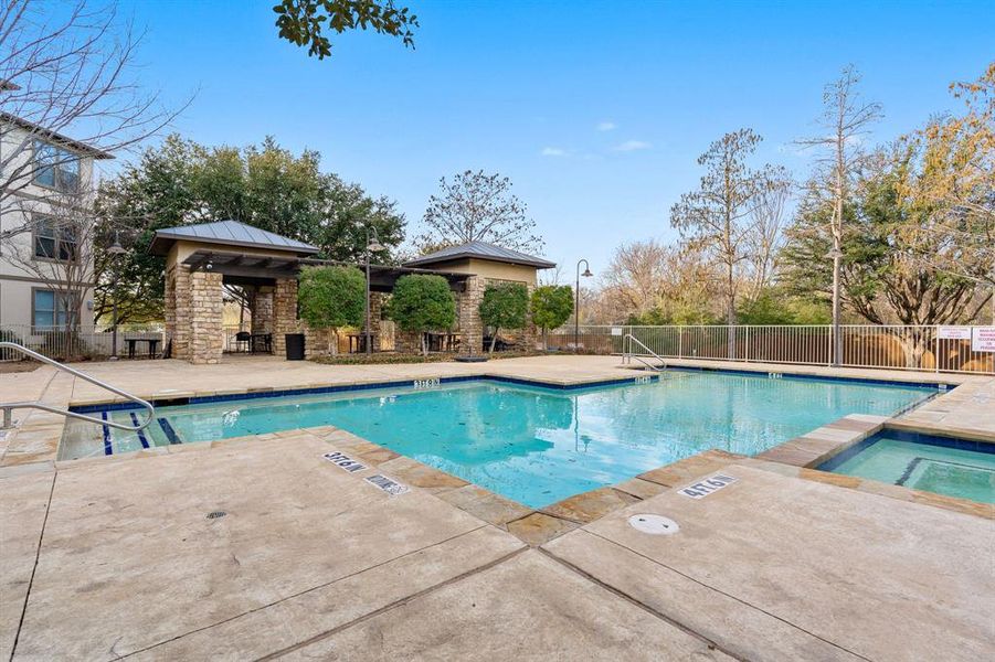 Pool with outdoor grill area.