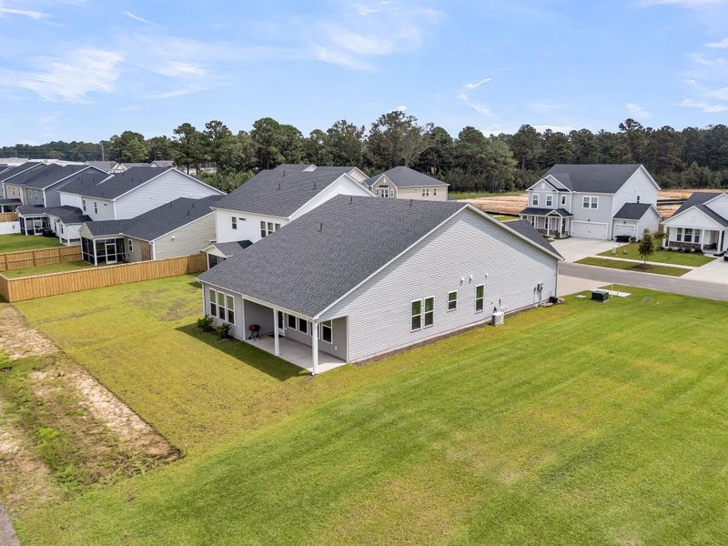 Front exterior of a new home in The Groves of Berkeley, Moncks Corner, SC, highlighting curb appeal (Image 27).