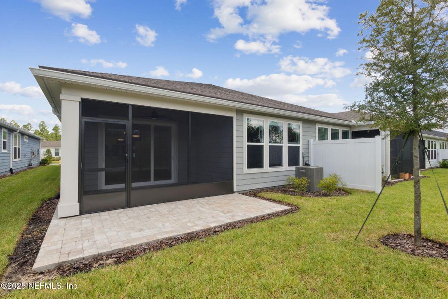 Front exterior of a new home in Del Webb Wildlight, Wildlight, FL, highlighting curb appeal (Image 2). Front exterior of a new home in Del Webb Wildlight, Wildlight, FL, highlighting curb appeal (Image 2).