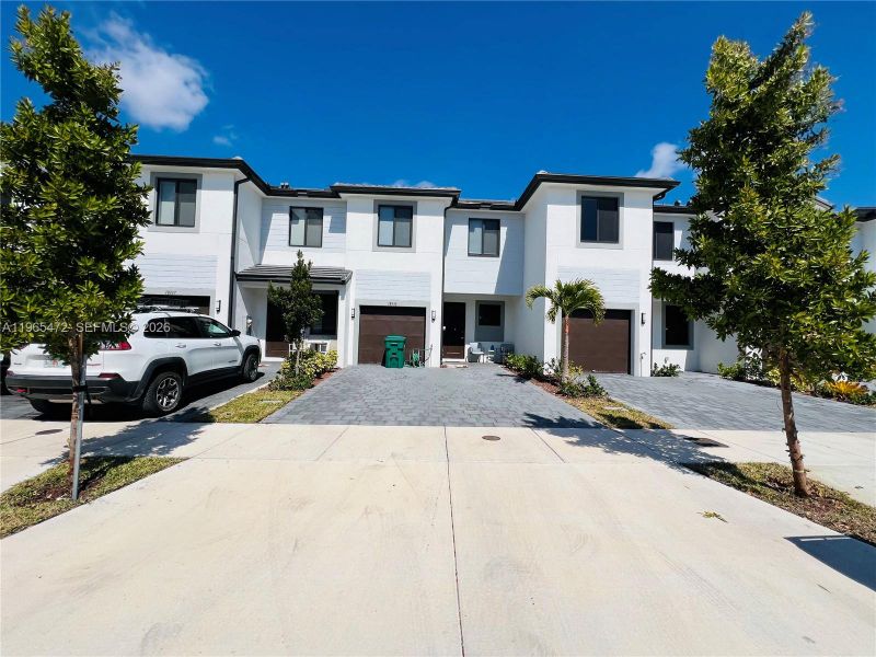 Front exterior of a new home in , Homestead, FL, highlighting curb appeal (Image 2). Front exterior of a new home in , Homestead, FL, highlighting curb appeal (Image 2).