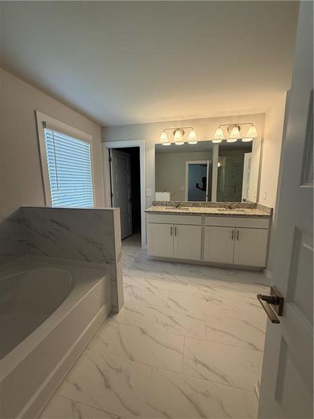 Furnished interior view inside a new home in The Fairways at Mirror Lake, Villa Rica (Image 6).