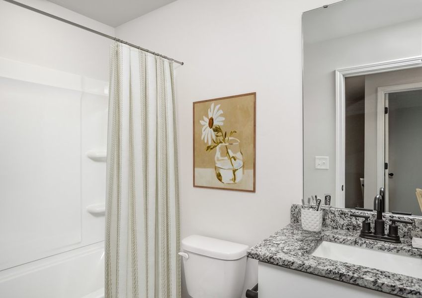 The bathroom has a large soaking tub