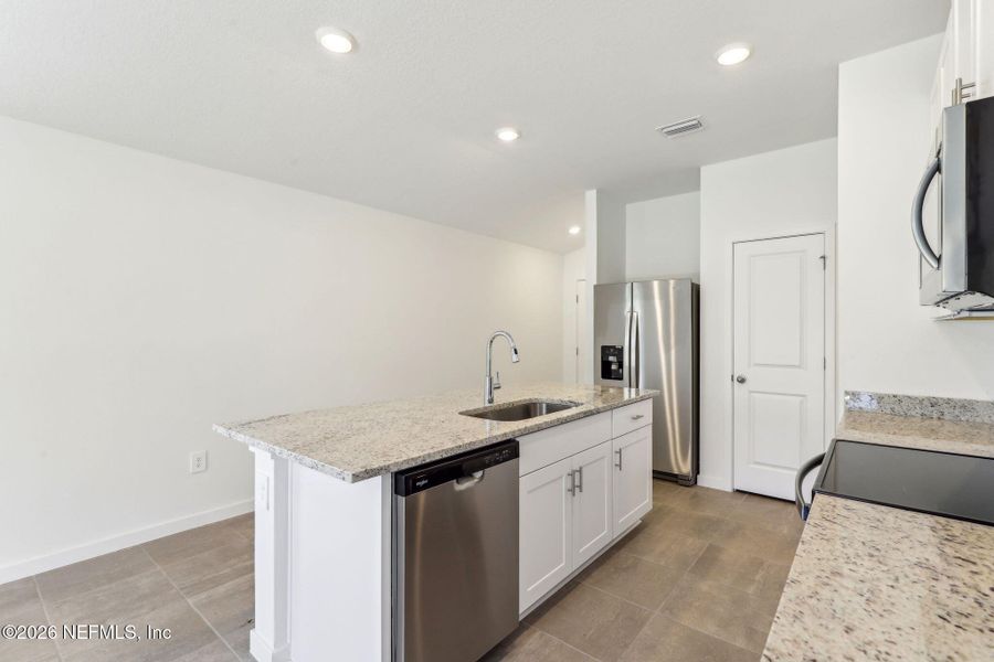 Furnished interior view inside a new home in Flagler Village - Classic Series, Palm Coast (Image 8).