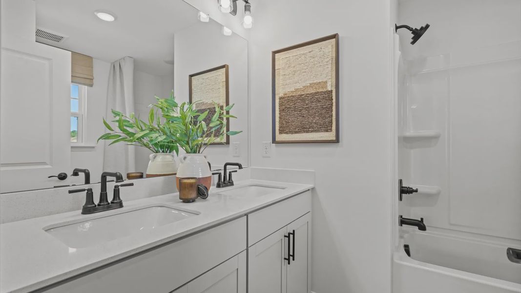 Wynwood home plan secondary bathroom with dual vanities and separate toilet room with shower Wynwood home plan secondary bathroom with dual vanities and separate toilet room with shower