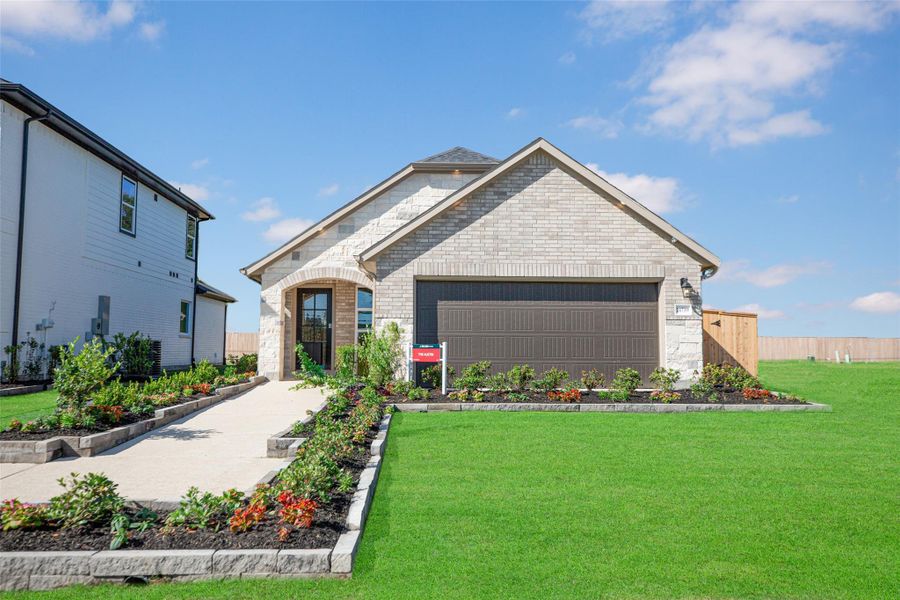 Front exterior of a new home in Montgomery Ridge: Landmark Collection, Montgomery, TX, highlighting curb appeal (Image 1).