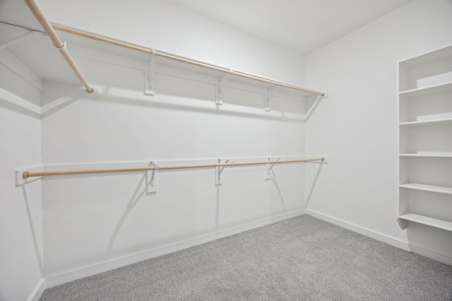 Primary Closet in the Oak II home plan by Trophy Signature Homes – REPRESENTATIVE PHOTO