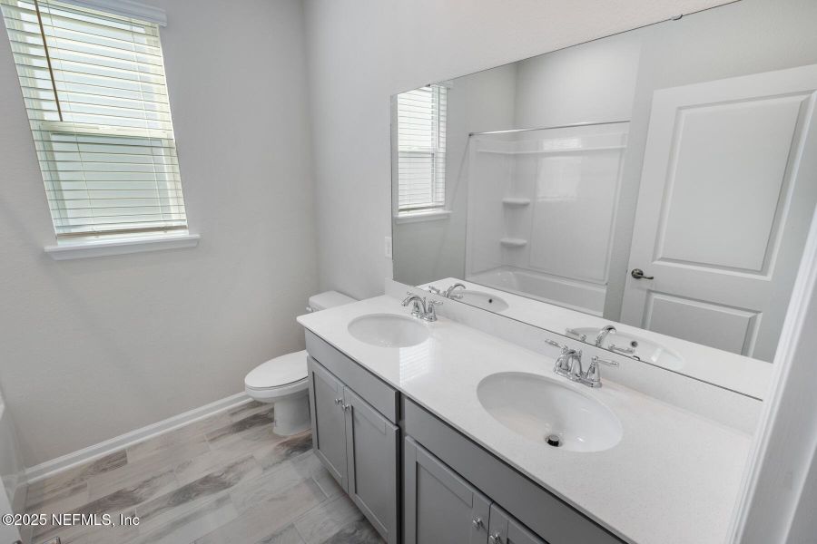 Furnished interior view inside a new home in Lakes at Bella Lago, Green Cove Springs (Image 14).