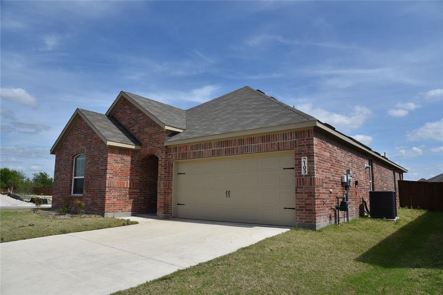 Front exterior of a new home in Walden Pond, Forney, TX, highlighting curb appeal (Image 2).