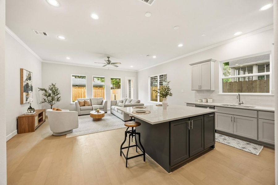This huge island offers adjustable shelves, perfect for storing cookbooks or frequently accessed items, while providing a stunning view of the entire open-concept first-floor living space. This huge island offers adjustable shelves, perfect for storing cookbooks or frequently accessed items, while providing a stunning view of the entire open-concept first-floor living space.
