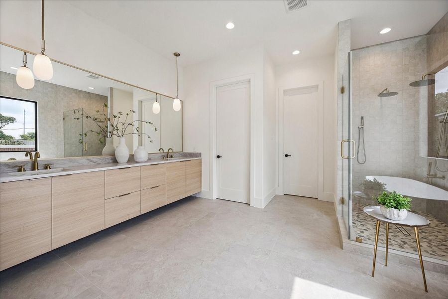 Primary bath - has floating spacious vanity with double sinks and designer pendants. Primary bath - has floating spacious vanity with double sinks and designer pendants.