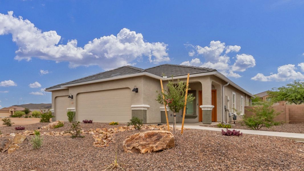 Front exterior of a new home in Saguaro Bloom, Marana, AZ, highlighting curb appeal (Image 2).