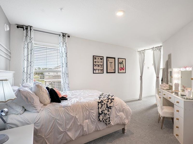 Large secondary bedrooms fit a queen-sized bed - Daisy townhome by Highland Homes