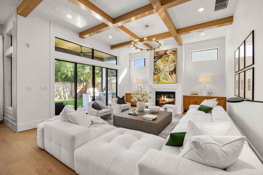 Family Room offers abundant space for large format furniture. Stately white oak ceiling beam detail match the floors. Large wall of windows to let in natural light. Family Room offers abundant space for large format furniture. Stately white oak ceiling beam detail match the floors. Large wall of windows to let in natural light.