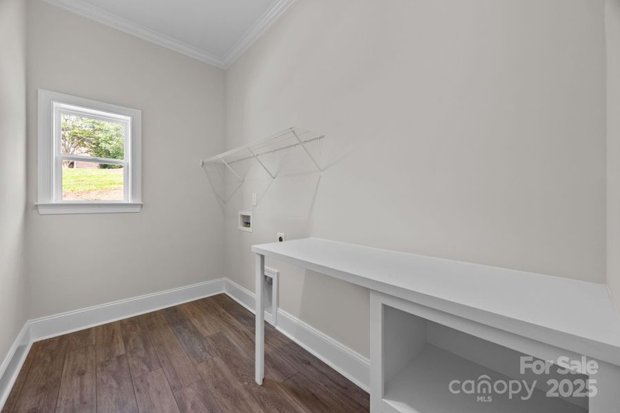 Laundry room with built in table and storage Laundry room with built in table and storage