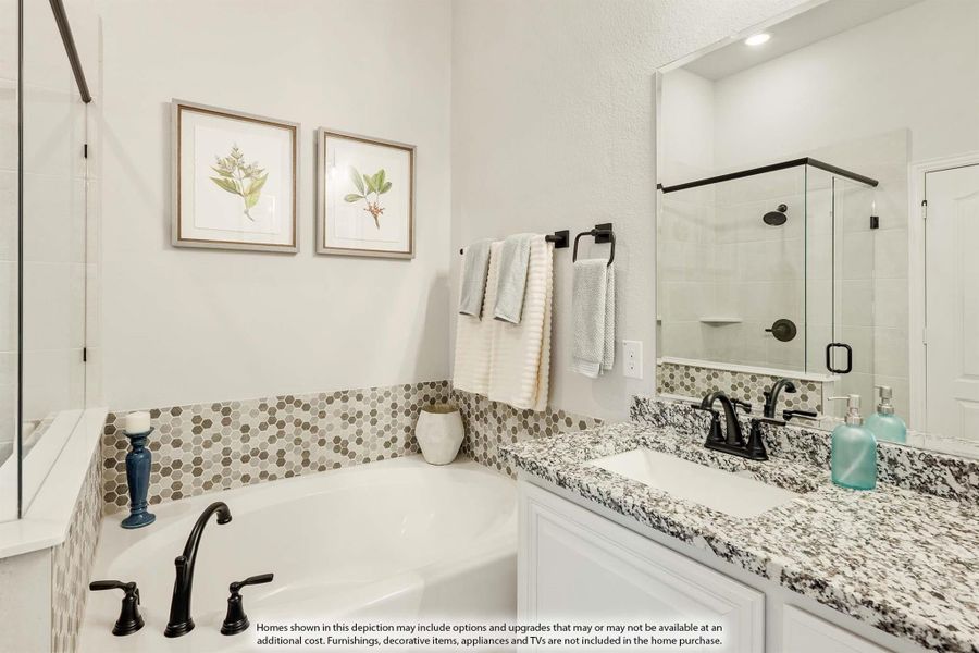 Bathroom with soaking tub, mosaic tile surround, granite vanity, and glass walk-in shower with black fixtures Bathroom with soaking tub, mosaic tile surround, granite vanity, and glass walk-in shower with black fixtures