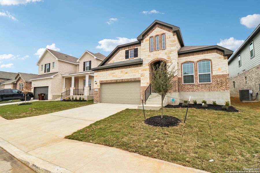 Front exterior of a new home in Sagebrooke - Classic Series, San Antonio, TX, highlighting curb appeal (Image 22).