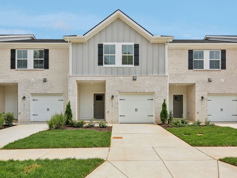 Front exterior of a new home in Cedarcrest Townhomes, Fairview, TN, highlighting curb appeal (Image 1).
