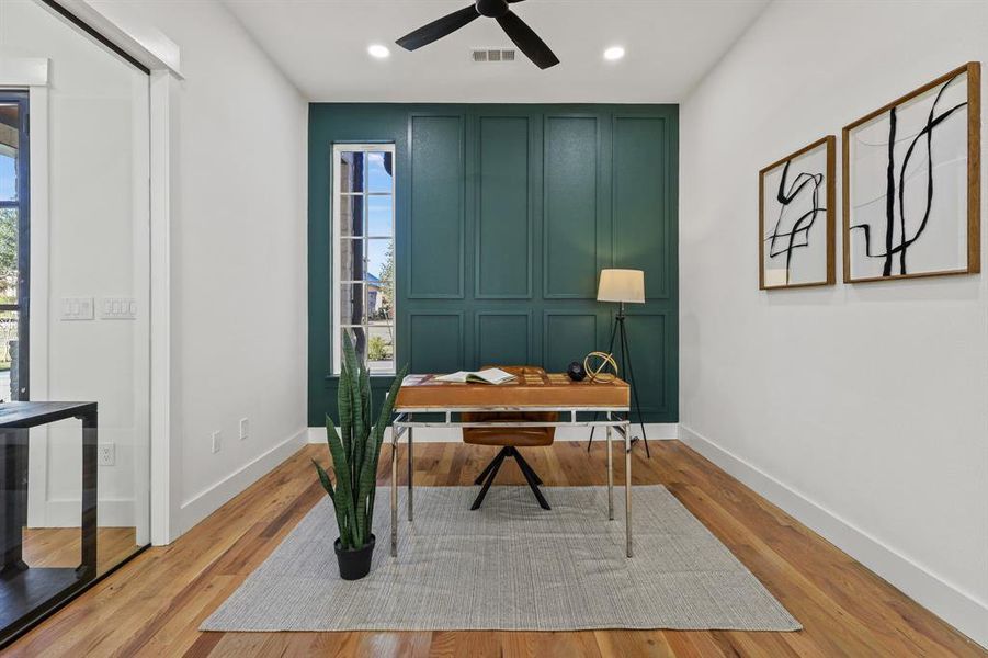 Office space featuring ceiling fan and light wood-type flooring