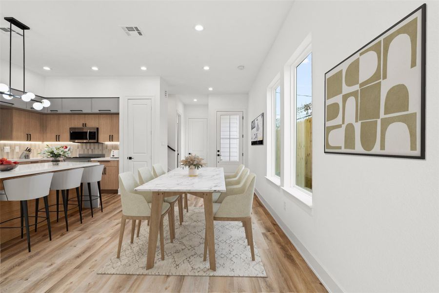 This spacious main level offers a beautiful open layout with abundant natural light and a smooth connection between living and kitchen areas. With a bright, modern feel throughout, it’s a space made for both relaxing and gathering.