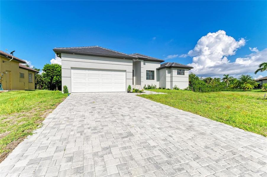 Front exterior of a new home in , Punta Gorda, FL, highlighting curb appeal (Image 25). Front exterior of a new home in , Punta Gorda, FL, highlighting curb appeal (Image 25).