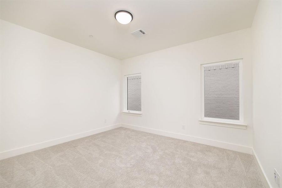Spacious, unfurnished interior of a new home in Dove Station, Grapevine (Image 22).