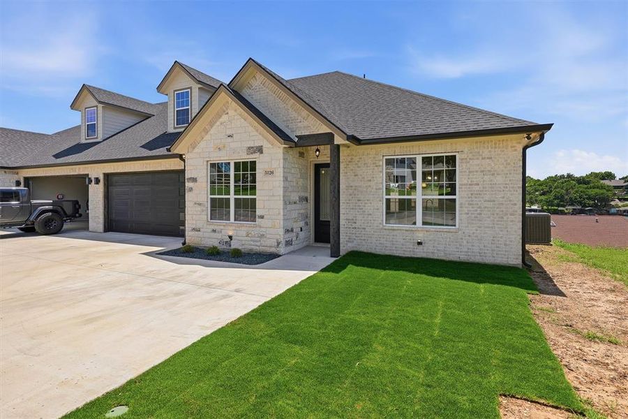 Front exterior of a new home in , Granbury, TX, highlighting curb appeal (Image 22). Front exterior of a new home in , Granbury, TX, highlighting curb appeal (Image 22).
