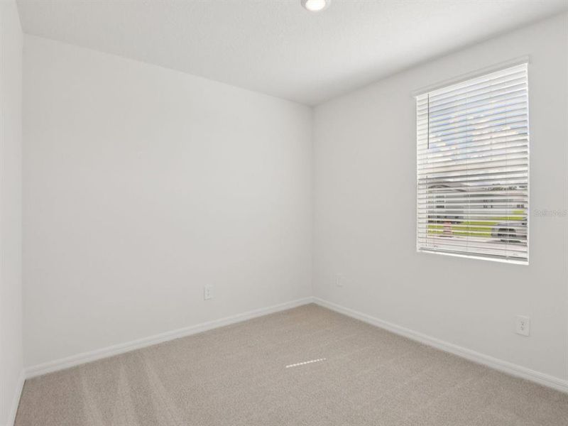 Spacious, unfurnished interior of a new home in The Grove at Stuart Crossing - Classic Series, Bartow (Image 11).