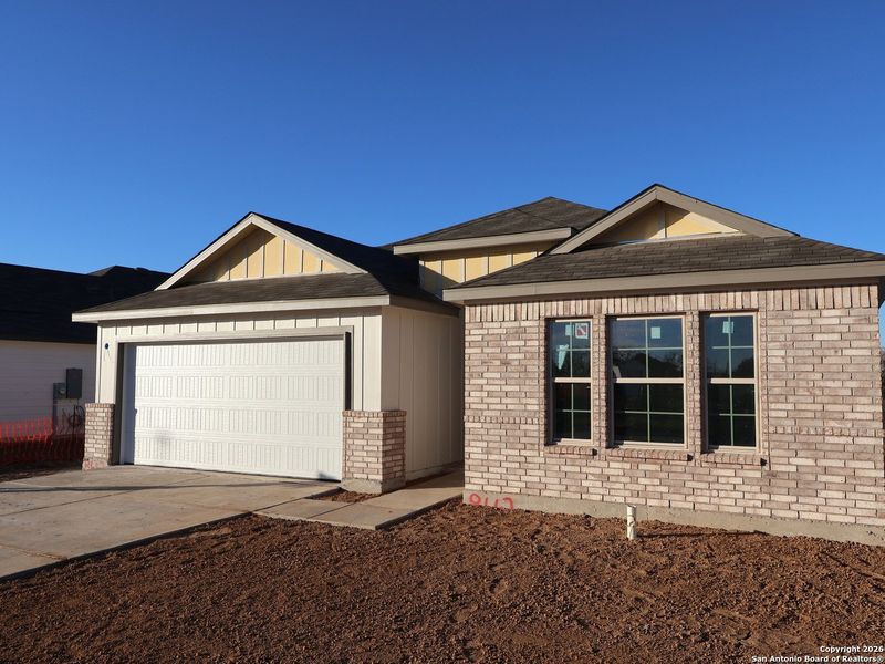 Front exterior of a new home in Cinco Lakes, San Antonio, TX, highlighting curb appeal (Image 18).